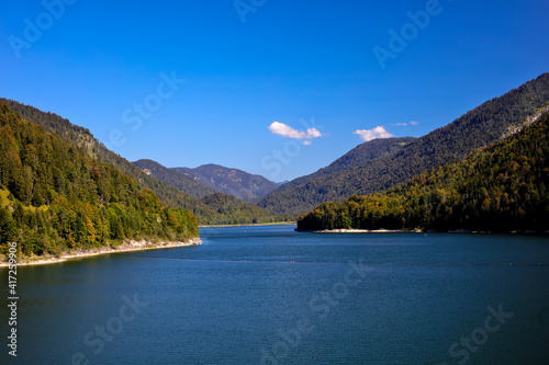 View of the Sylvenstein reservoir in the Upper Bavarian Isarwinkel (Sylvensteinstausee, Sylvensteinsee), which dams the river Isar. Iarwinkel, Isar Valley, Fall, Lenggries, Bavaria, Germany photo