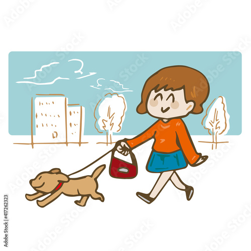犬の散歩をする女性 背景あり