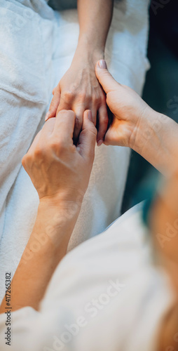 Upper view photo of a finger and palm massage at the spa center photo