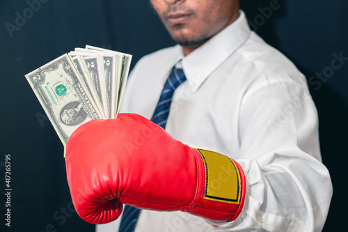 Concept of business competition Businessman standing in red boxing gloves, success in uncle business, investment struggle for investment concept