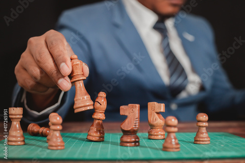The concept of placing the game Business people use chess to plan competitive games or make successful business investments. Management strategy concept