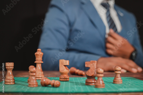 The concept of placing the game Business people use chess to plan competitive games or make successful business investments. Management strategy concept