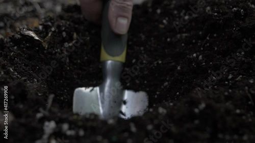 Close up of digging soil photo