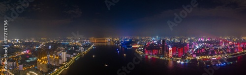 wuhan light show.Panoramic skyline and buildings beside yangtze river.