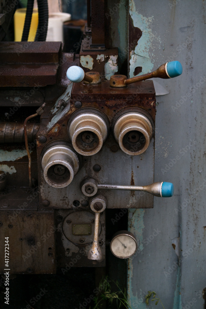 Rusted knobs on outdated equipment