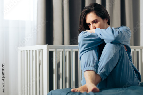 Unhappy Woman Suffering from Post-Partum Depression photo