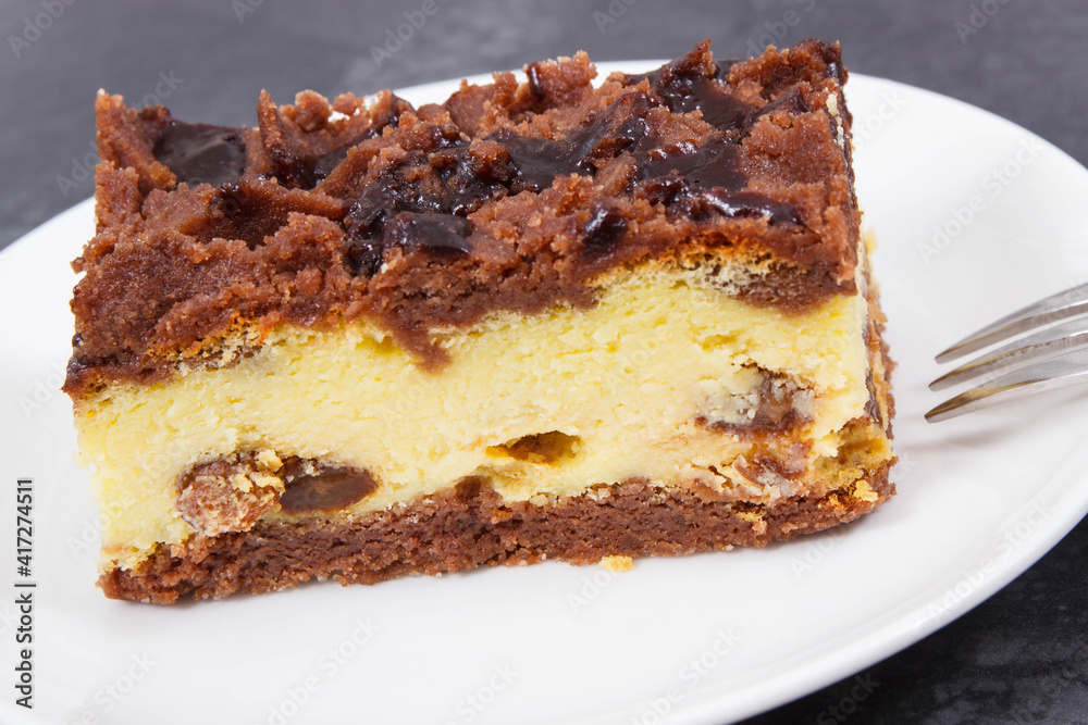 Piece of fresh cheesecake on white plate. Delicious dessert