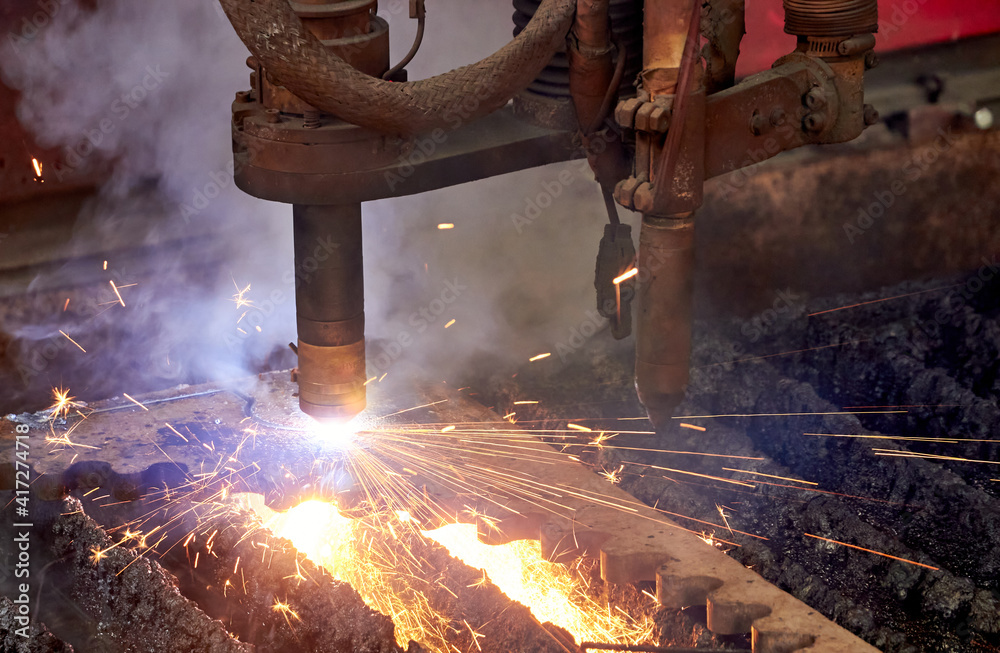 sparks of plasma cutting machine nozzles during cutting metal detail