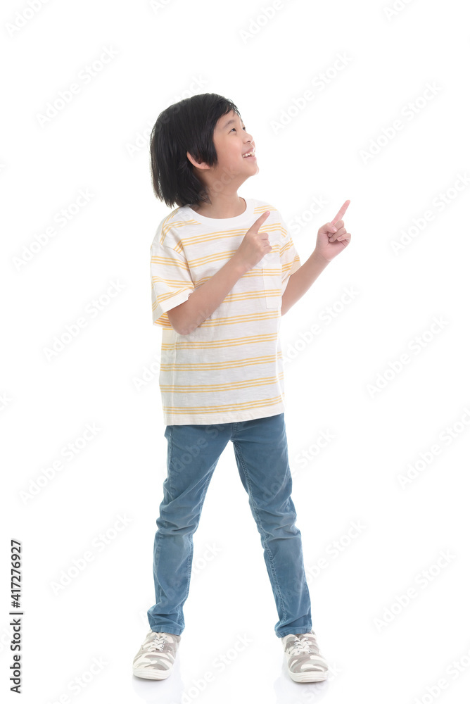 Cute Asian child pointing on white background isolated Cute Asian child pointing on white background isolated