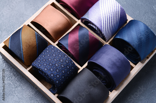 Obraz na płótnie Box with stylish neckties on dark background