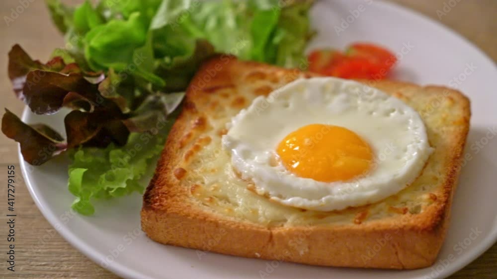 homemade bread toasted with cheese and fried egg on top with vegetable salad for breakfast homemade bread toasted with cheese and fried egg on top with vegetable salad for breakfast