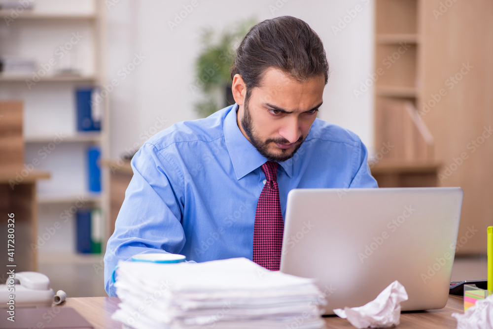 Young male employee in brainstorming concept Young male employee in brainstorming concept