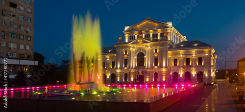 Illuminated Culture Palace with colored kinetic fountain in Drobeta Turnu-Severin at night