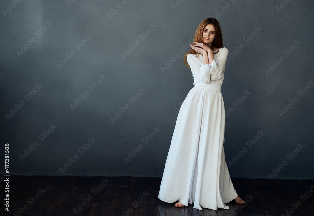 attractive woman in white dress glamor gray background attractive woman in white dress glamor gray background