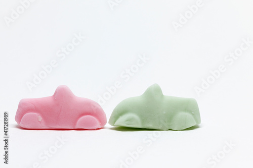 a pink and a green candy car