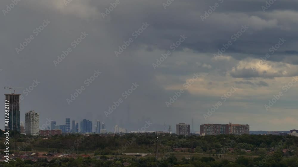 Time-lapse of Toronto city with skyscrapers in background during storm Time-lapse of Toronto city with skyscrapers in background during storm
