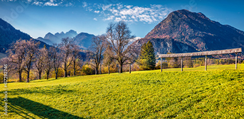 Beautiful autumn scenery. Panoramic morning view of Triglav mountain range and Gozd Martuljek village. Spectacular morning scene of Julian Alps, Slovenia. Beauty of nature concept background.