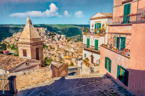 Сharm of the ancient cities of Europe. Sunny spring cityscape of Ragusa town with Church of St Mary of the Stairs on background. Wonderfulmorning scene of Sicily, Italy, Europe. #417283527