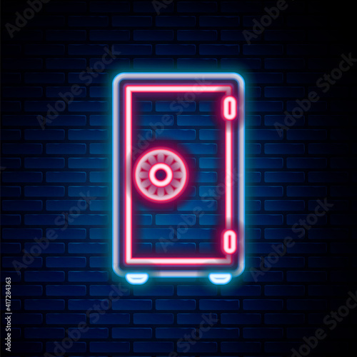 Glowing neon line Safe icon isolated on brick wall background. The door safe a bank vault with a combination lock. Reliable Data Protection. Colorful outline concept. Vector.
