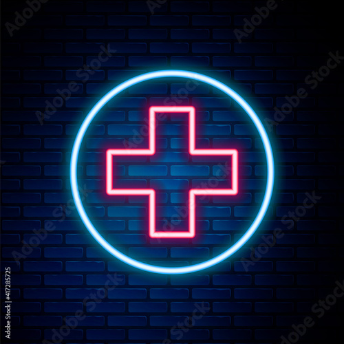 Glowing neon line Medical cross in circle icon isolated on brick wall background. First aid medical symbol. Colorful outline concept. Vector.
