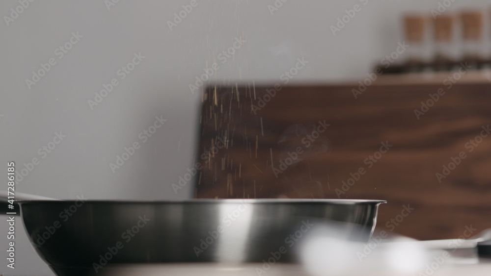 shot of sesoning put steak on nonstick pan shot of sesoning put steak on nonstick pan