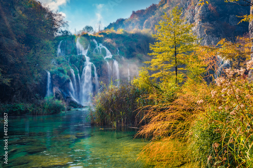 Landscape photography. Sunny morning view of pure water waterfall in Plitvice National Park. Picturesque autumn scene of Croatia, Europe. Abandoned places of Plitvice lakes series.
