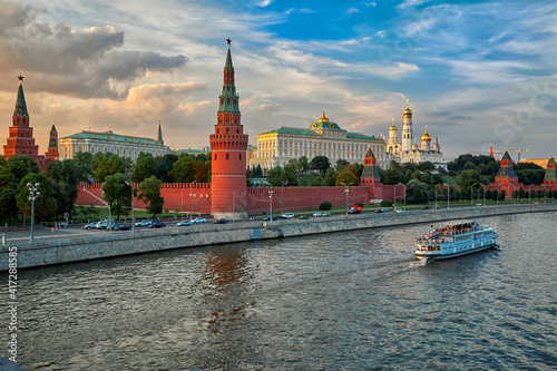 View of the Moscow Kremlin from the Moscow river. Red brick towers and Bell Tower Of Ivan The Great. Grand Kremlin palace. Travel to the capital of Russia. Moscow, Russia.