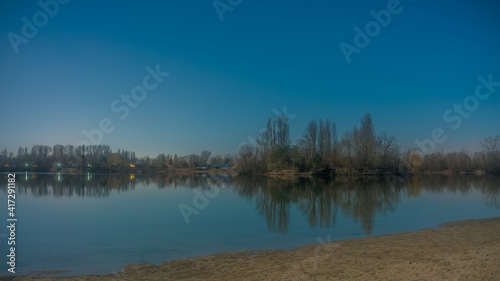 Panoramic landscape with the quarry lake Binsfeldsee near Speyer in Germany.