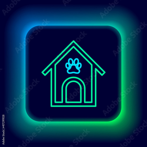 Glowing neon line Dog house and paw print pet icon isolated on black background. Dog kennel. Colorful outline concept. Vector.