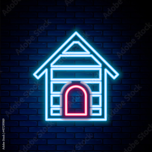Glowing neon line Dog house icon isolated on brick wall background. Dog kennel. Colorful outline concept. Vector.