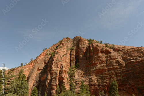 Scenic view of the mountains, cliffs and trees at Zion National Park on a sunny day