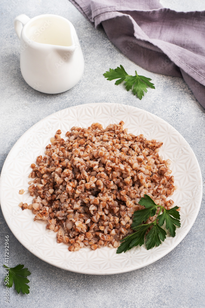 Boiled buckwheat on a plate. Healthy porridge enriched with vitamins. copy space, Boiled buckwheat on a plate. Healthy porridge enriched with vitamins. copy space,