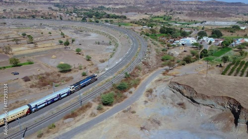 Drone footage of a passenger train at Daundaj near Pune India. photo