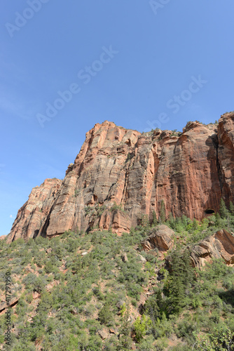 Scenic view of the mountains, cliffs and trees at Zion National Park on a sunny day