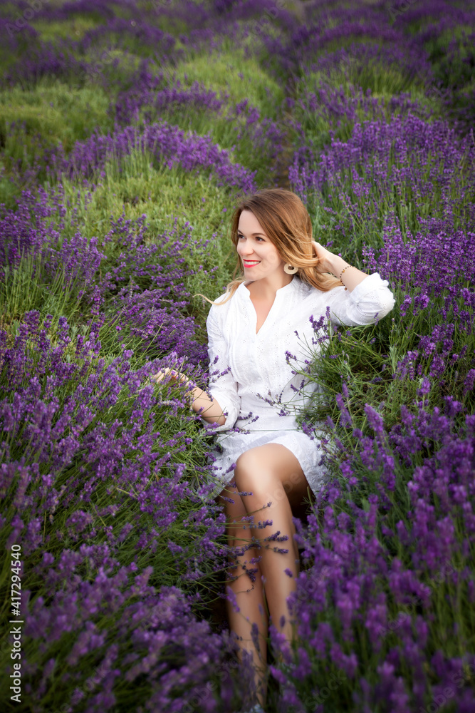 Young woman having fun in a lavender field Young woman having fun in a lavender field