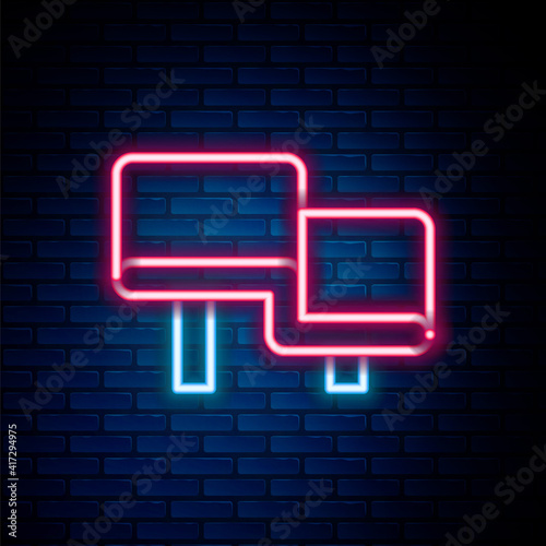 Glowing neon line Sauna wood bench icon isolated on brick wall background. Colorful outline concept. Vector.