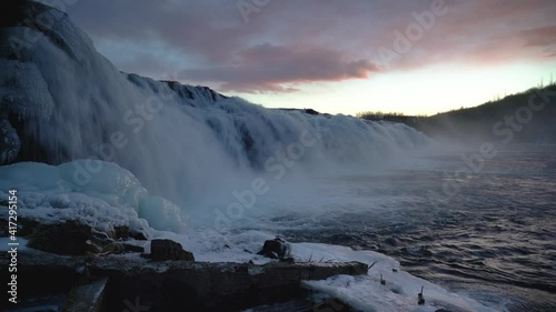 Extreme Water Cascade Splashing Down At Faxi Waterfall In Golden Circle, Iceland. low-level, panning shot photo