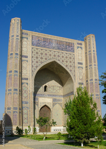 Beautiful blue tile decoration on facade of monumental gate of ancient Bibi Khanum or Khanym mosque in UNESCO listed Samarkand, Uzbekistan
