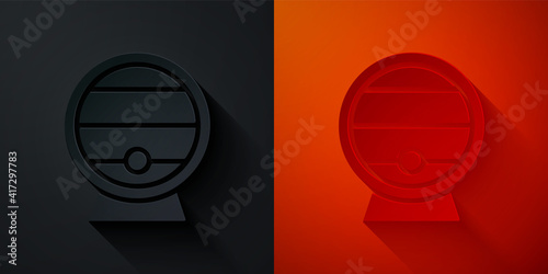 Paper cut Wooden barrel on rack with stopcock icon isolated on black and red background. Paper art style. Vector.