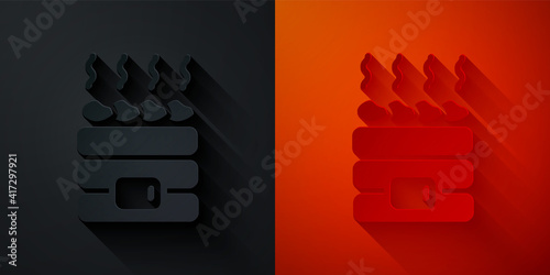 Paper cut Hot sauna stones icon isolated on black and red background. Spa resort recreation, bathhouse relaxation. Hot stones on electric heater. Paper art style. Vector.