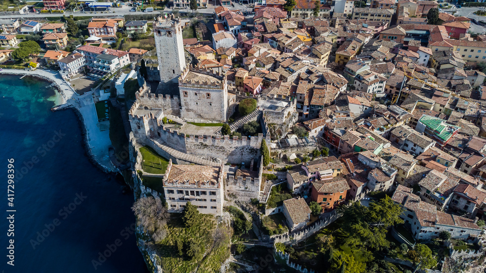 Incredible aerial view of the Medieval Castle of Malcesine on the shores of Lake Garda.