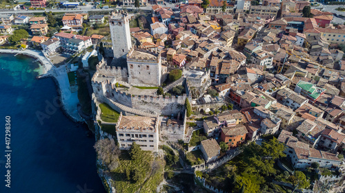 Obraz na płótnie Incredible aerial view of the Medieval Castle of Malcesine on the shores of Lake Garda. w salonie