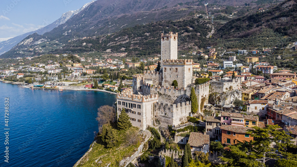Incredible aerial view of the Medieval Castle of Malcesine on the shores of Lake Garda.