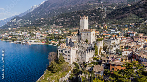 Obraz na płótnie Incredible aerial view of the Medieval Castle of Malcesine on the shores of Lake Garda. w salonie
