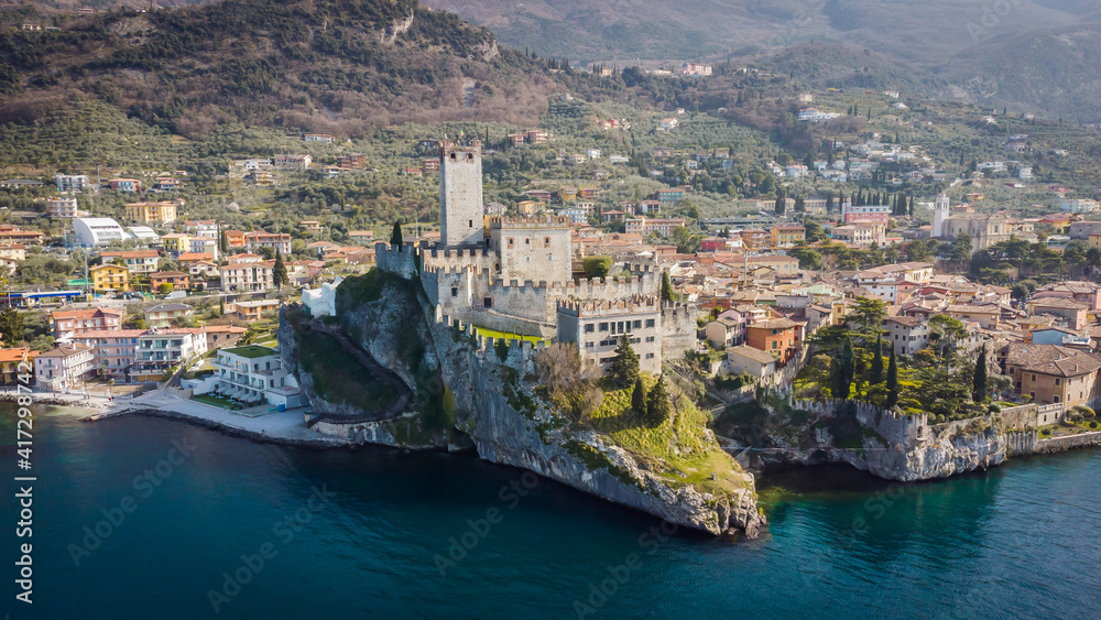 Incredible aerial view of the Medieval Castle of Malcesine on the shores of Lake Garda.