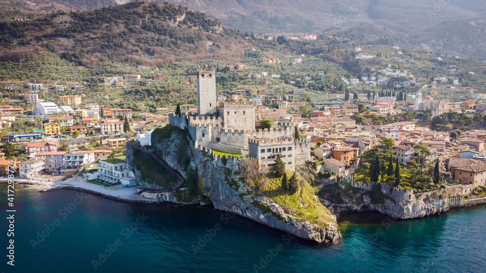 Incredible aerial view of the Medieval Castle of Malcesine on the shores of Lake Garda.