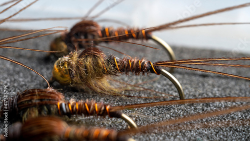 Macro. The inside of a fisherman's flybox, with an assortment of hand-tied trout flies. photo