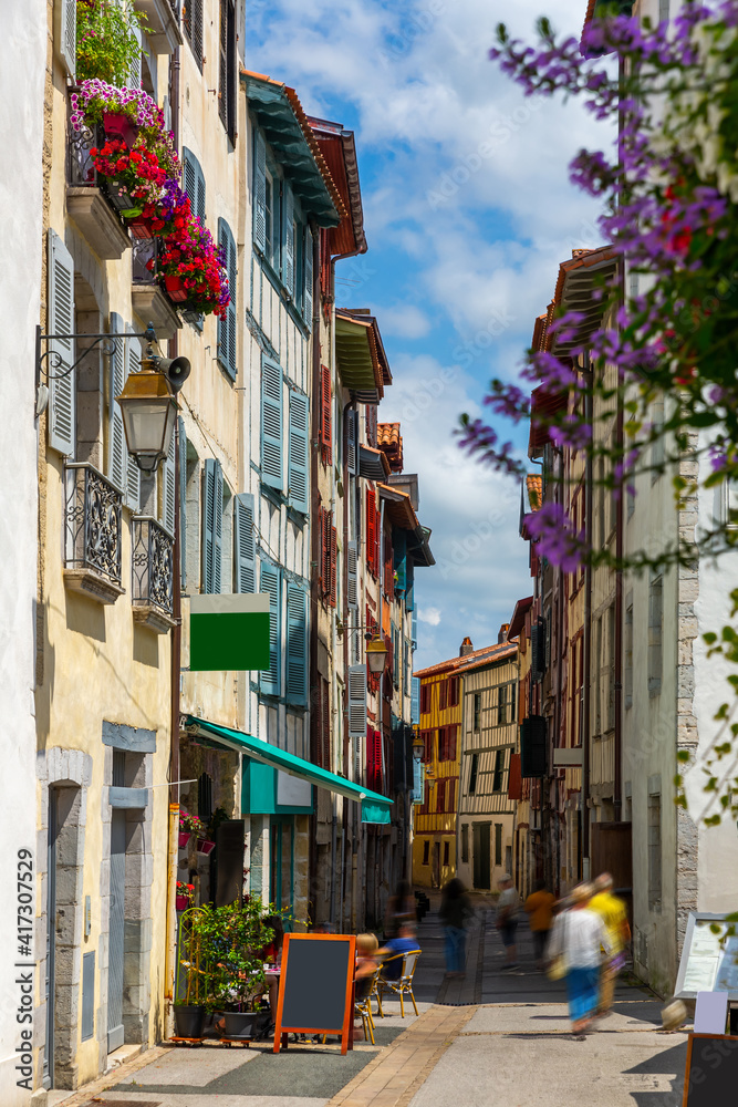 Street with historical houses in Bayonne city center. France