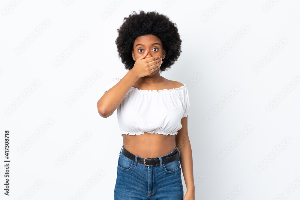 Young African American woman isolated on white background covering mouth with hand Young African American woman isolated on white background covering mouth with hand