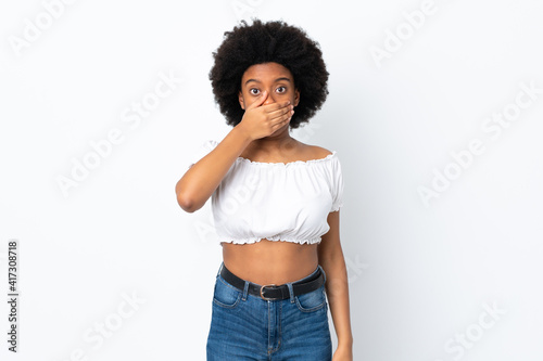Young African American woman isolated on white background covering mouth with hand